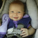 Happy baby in purple